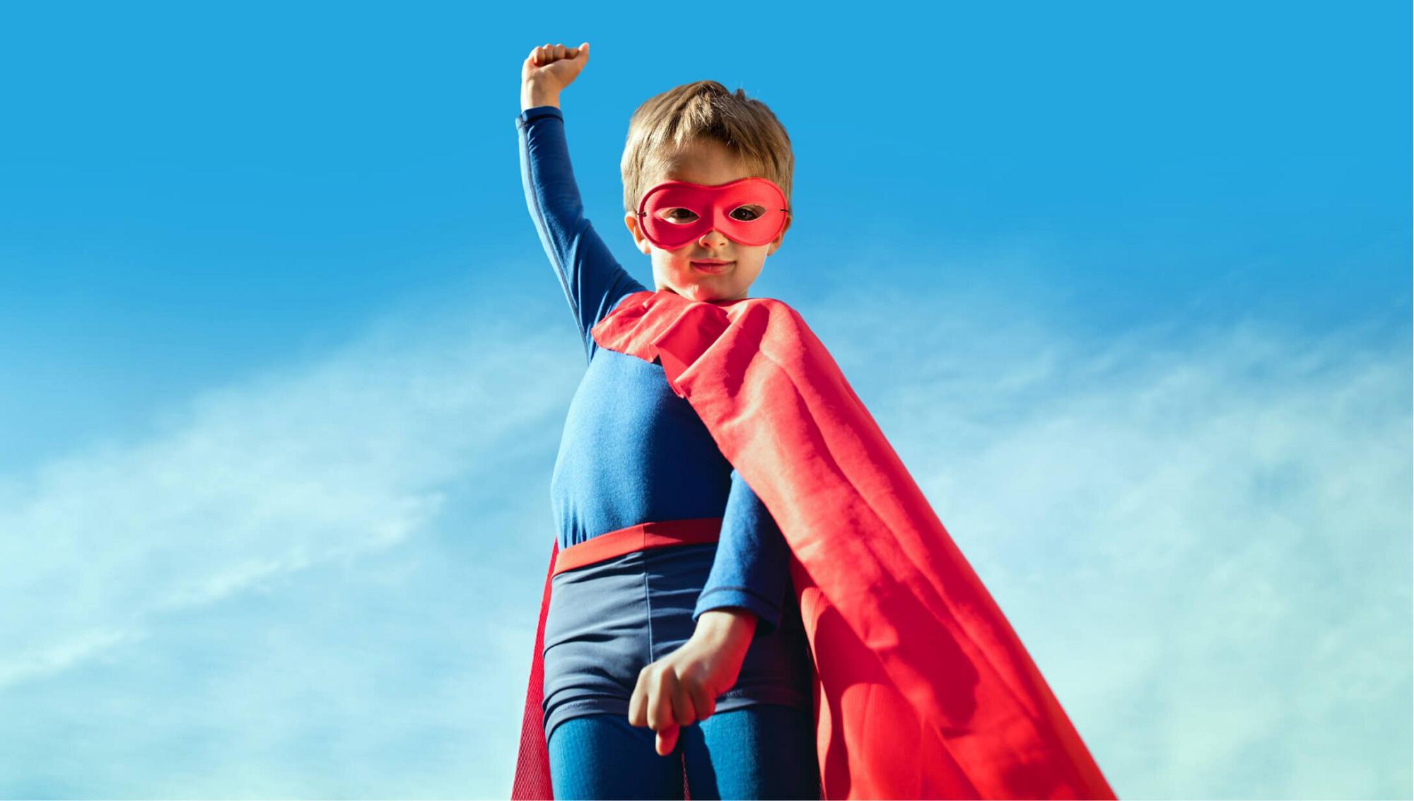 KidsKuts Patient dressed as a superhero
